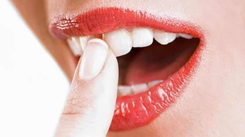 шатается зуб во сне к чему